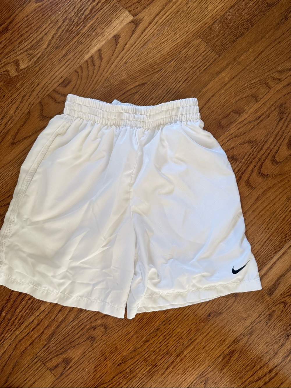 Nike Kids White Athletic Shorts with Black Swoosh